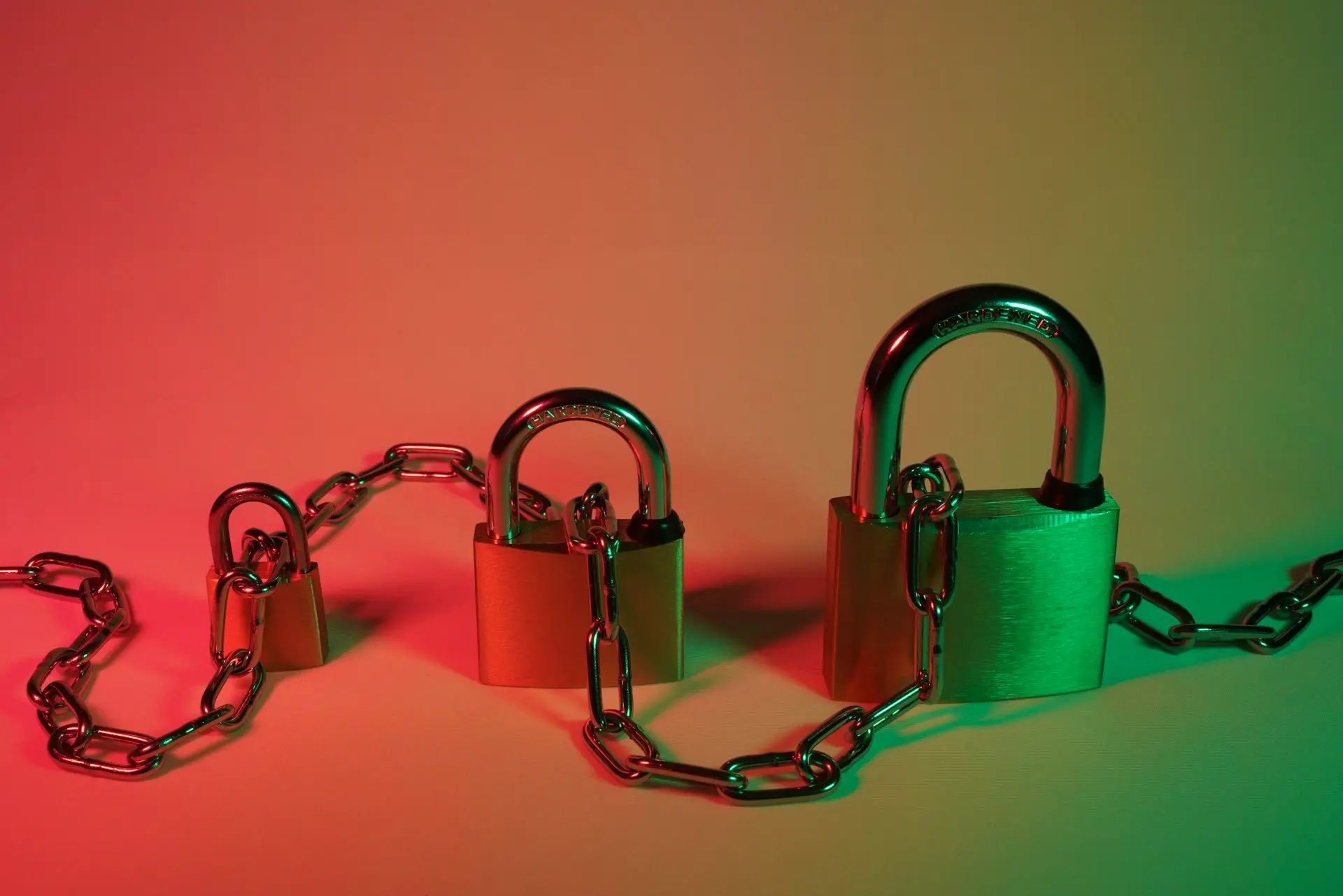 green padlock on pink surface